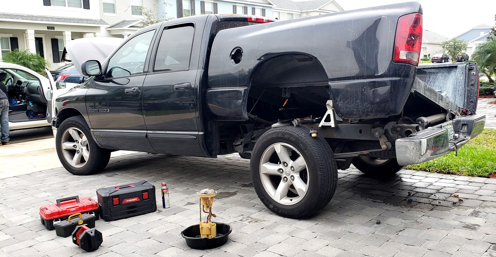 Pickup truck with wheel removed during repair